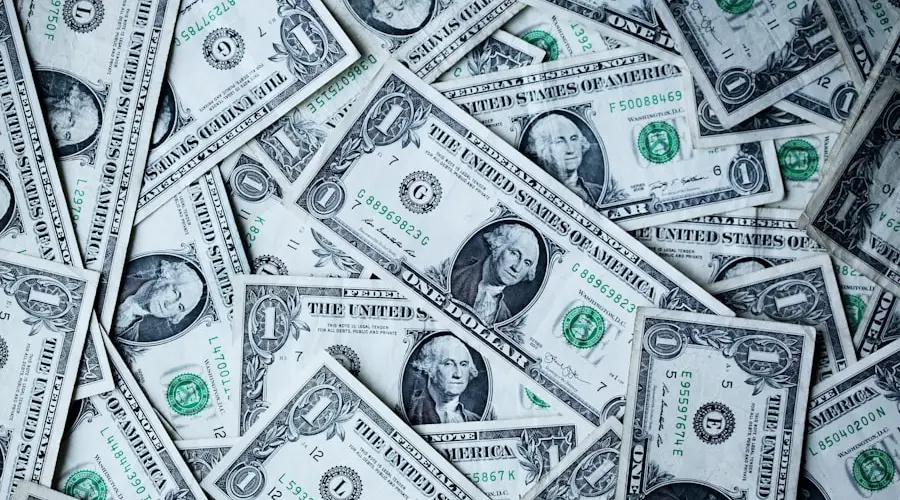 US dollar bills and financial charts illustrating the impact of rising bond yields and inflation fears
